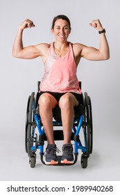 Athlete In A Wheelchair Flexing Her Arms