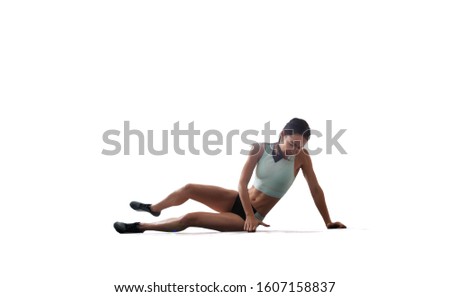 Athlete woman doing a long jump isolated on white background.