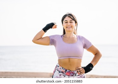 Athlete Woman Making The Gesture Of Strength With Her Arm