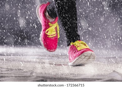 Athlete Woman Is Running During Winter Training Outside In Cold Snow Weather.