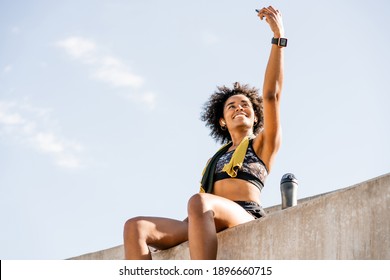 Athlete woman taking a selfie with phone outdoors. - Powered by Shutterstock