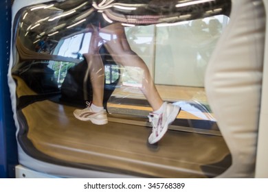 Athlete Working Out On An Anti Gravity Treadmill At The Gym