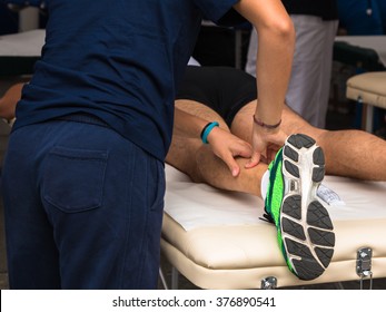 Athlete's Calf Muscle Professional Massage Treatment after Sport Workout, Fitness and Wellness - Powered by Shutterstock