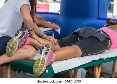 Athlete's Calf Muscle Professional Massage Treatment after Sport Workout: Fitness and Wellness - Powered by Shutterstock