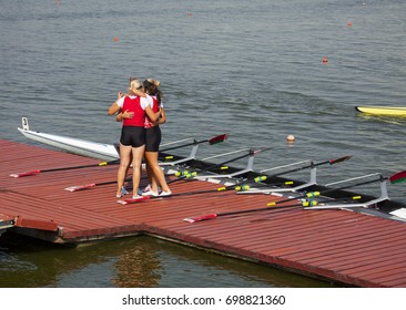 Athletes celebrate the victory. National championship in rowing. Athletes during the competition.