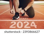 Athletes are getting ready to run on the track with the text  2024 in New Year