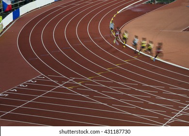 Athletes on the track in motion. Professional race was preparation on olympic game in Rio