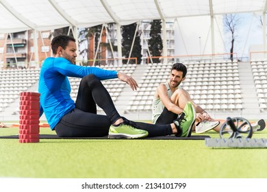 Athletes Stretching in Athletic Track - Powered by Shutterstock