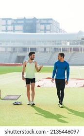 Athletes Talking In Athletic Track