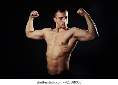 Muscular Man Posing Showing His Biceps Stock Photo (Edit Now) 676691818