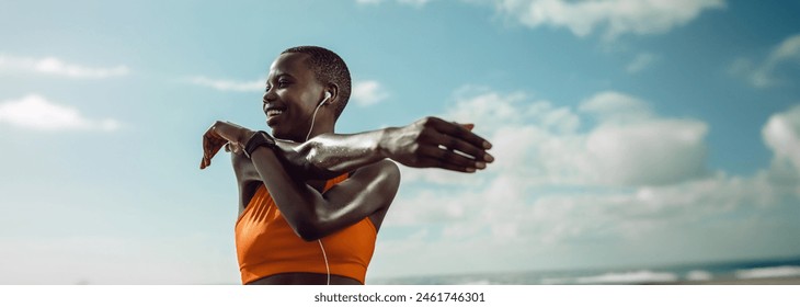 Athletic black woman stretching outdoors focused on fitness and exercise. A female runner prepares for a run, emphasising proper warm-up for her daily exercise and running training. - Powered by Shutterstock