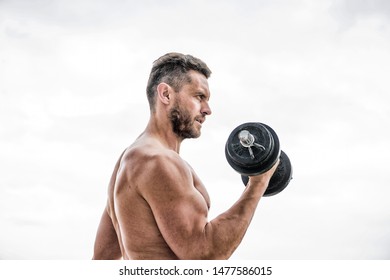 Athletic Body. Dumbbell Gym. Muscular Man Exercising In Morning With Barbell. Fitness And Sport Equipment. Success. Perfect Biceps. Man Sportsman Weightlifting. Steroids. Getting Into The Groove.