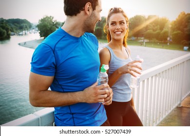 Athletic Couple Jogging Together Outdoors