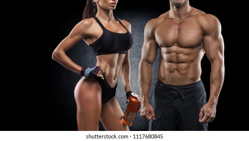 athletic couple poses for the camera