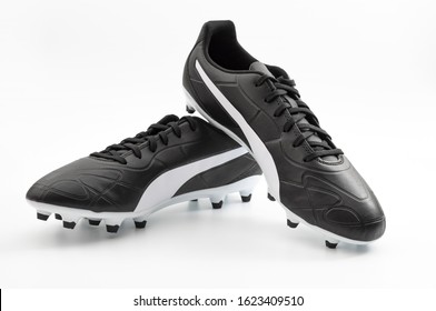 Athletic Equipment And Exercising Footwear Concept Traditional Leather Soccer Boots Or Football Cleats Shoes Isolated On White With Clipping Path Cutout