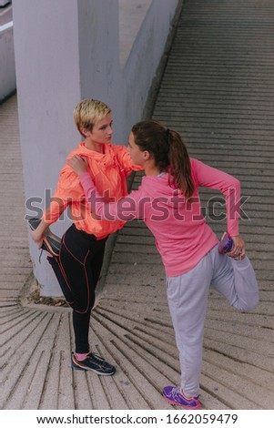 Similar – Two women walking by sea pier