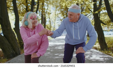 Athletic Fitness Senior Elderly Sport Jogger Man, Woman Training Running Cardio Workout In Summer Park At Morning. Old Grandparents Starting Run Race Together. Active Retired Mature People Motivation