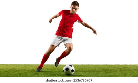 Athletic football player in red-white uniform, practicing dribbling on green pitch, training to master footwork and agility against white background. Concept of championship, sport events, final game - Powered by Shutterstock