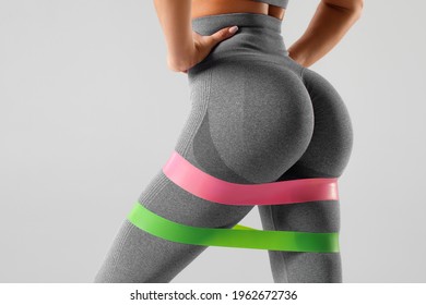 Athletic Girl Doing Exercise For Glutes With Resistance Band. Beautiful Butt, Fitness Woman Working Out