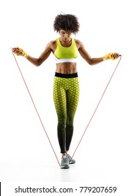 Athletic Girl With A Jump Rope On White Background. Best Cardio Workout