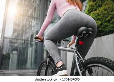 Athletic Girl With Pumped Buttocks Rides A Bicycle