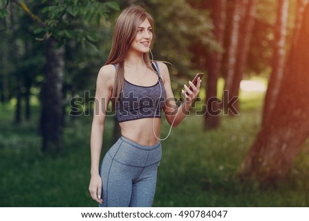 Similar – Attractive sporty woman with her cell phone