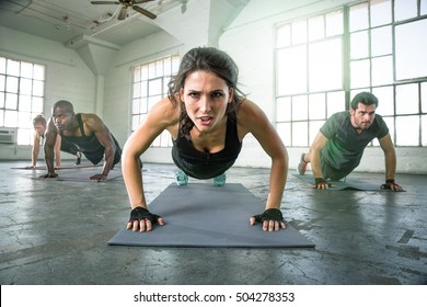 Athletic Group Of Fit Multi-ethnic People Exercising With Vigor Vitality Passion