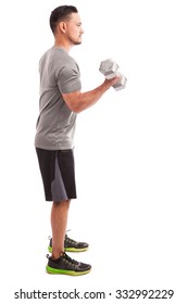 Athletic Guy Working On His Biceps Doing A Few Bicep Curls On A White Background