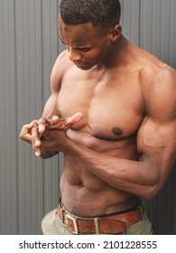 An Athletic Handsome Italian Man Is Demonstrating Shirtless Torso