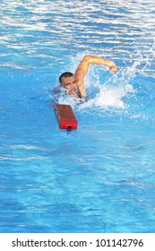 Athletic Lifeguard In Swimming Pool