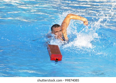 Athletic Lifeguard In Swimming Pool