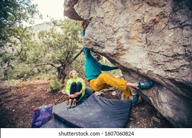 Athletic Man Climbing Hard Boulder Problem In Forest. Sport Climbing, Bouldering. Outdoor. Top View Of Gripping Hand.