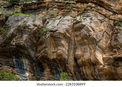 Athletic man climbs an overhanging rock with rope, lead climbing.  A rock climber on a mountain background. outdoor sports and recreation, Cukurca, Hakkari - Powered by Shutterstock