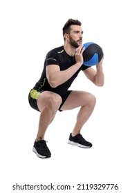 Athletic Man Doing Squats With Medicine Ball Isolated On White