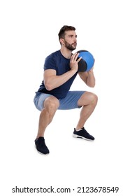 Athletic Man Doing Squats With Medicine Ball Isolated On White