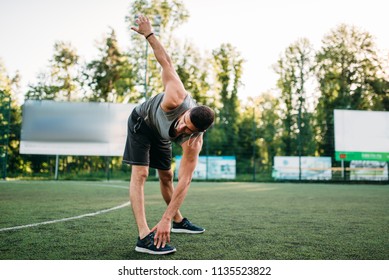 Athletic Man Doing Stretching Exercise, Side View