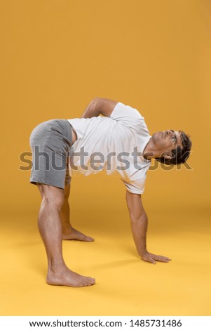 Similar – Mexican yoga teacher practicing side angle pose