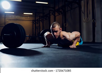 Athletic Man Exercise At Gym Doing Burpee Over The Bar