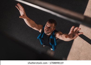 Athletic Man Getting Ready To Do Pull-ups In Gym. Power Pull Up Workout