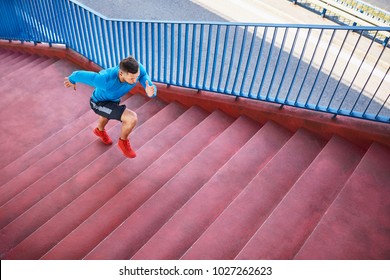 Athletic Man Running On Stairs Doing Interval HIIT Exercise