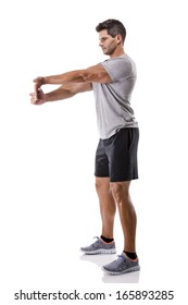 Athletic Man Stretching Arms, Isolated Over A White Background