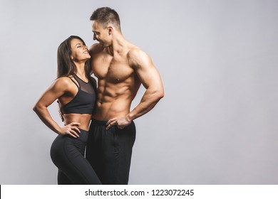 Athletic man and woman isolated over white background. Personal fitness instructor. Personal training.