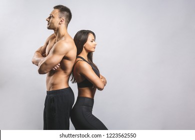 Athletic Man And Woman Isolated Over White Background. Personal Fitness Instructor. Personal Training.