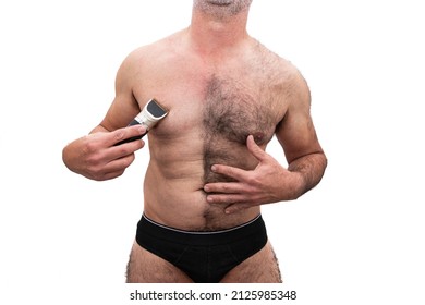 An Athletic Older Caucasian Man, Bare Chested Hairy, Holding A Razor In His Hand, Half Shaved Chest. Isolated On White Background.