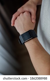Athletic runner start training on fitness tracker or smart watch and looking forward on horizon. Trail running and active lifestyle concept.