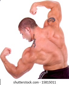 Athletic Sexy Attractive Male Body Builder, Demonstrating Contest Pose. Studio Shot, Black White Ground.