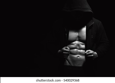 Athletic Strong Sexual Man Abs Six Pack Muscles Bodybuiding And Fitness Concept. Studio Shot, Monochrome, Black And White. Copy Space On Background