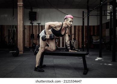 Athletic Woman Doing Dumbbell Row Exercise With One Hand. Back Muscle Training. Bodybuilding And Fitness