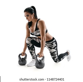 Athletic Woman Doing Lunges With Kettlebells. Photo Of Latin Woman In Military Sportswear Isolated On White Background. Strength And Motivation