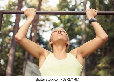 Athletic Woman Doing Pull Up